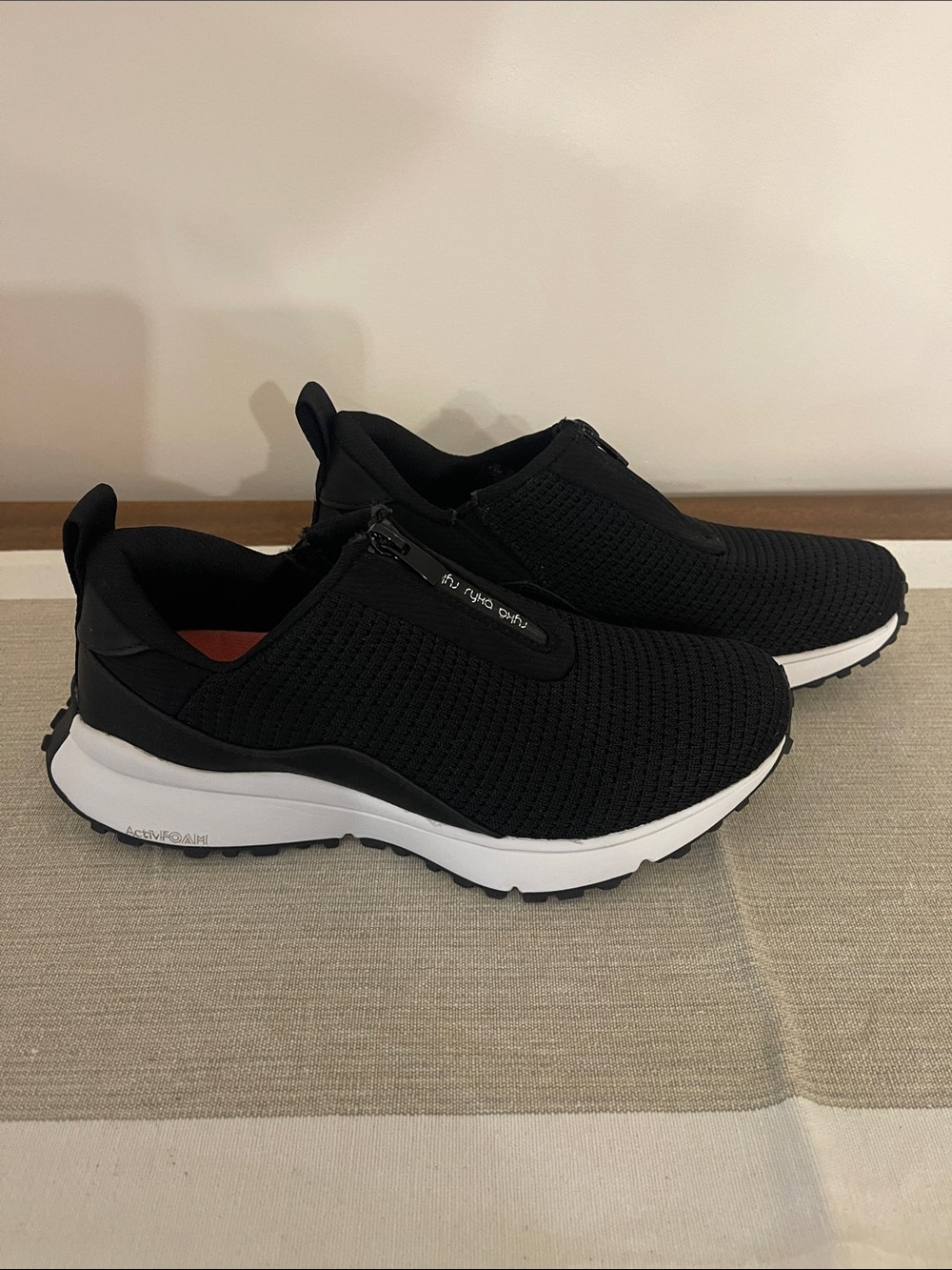 Ryka Black Slip-On Knit Sneakers with White Sole